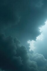Ominous, dark grey clouds fill the frame, heavy rain imminent , dark sky, gloom, thunderclouds