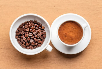 Coffee beans and ground coffee in cups top view on a wooden table
