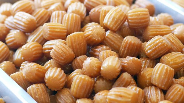 urkish dessert, Tulumba at the market.
