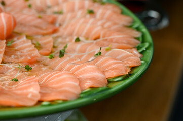 fresh salmon fillet, chinese food in a restaurant, food in a restaurant, buffet style food, fresh salmon steak, raw salmon steak, raw salmon on a plate, salmon, raw fish, food on the table
