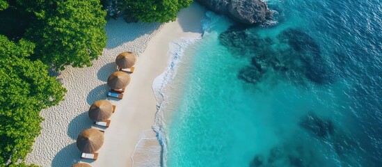 Beach with Umbrellas and Turquoise Water Aerial View