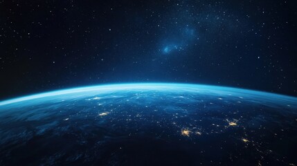 Obraz premium A Stunning View of Earth from Space at Night with Bright City Lights and Starry Sky Above
