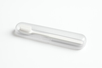 A sleek, modern toothbrush enclosed in a transparent travel case, designed for convenience and hygiene. Perfect for on-the-go dental care.