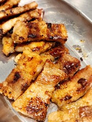 Grilled Pork Belly Slices on Stainless Tray
