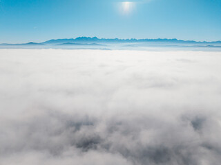 MIsty Panorama High Tatras Mountains with meadow from Poland