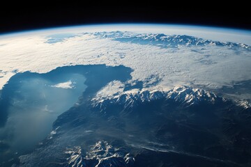 View of planet Earth from space showcasing mountains, clouds, and water bodies over a serene landscape, Planet Earth view from space