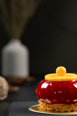 Glossy Red Dome Dessert with Yellow Cap