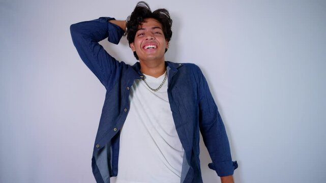 Man standing bursts out laughing in pure joy