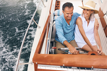Boat, love and romance with mature couple on ocean or sea from above for travel and vacation. Date,...