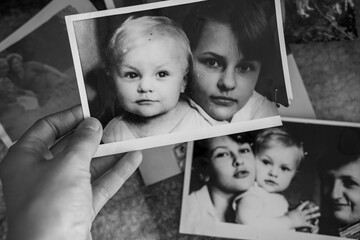 A vintage heartfelt photo of a loving brother and sister, in soft sepia, black and white tones. An old, slightly yellowed retro photo taken in the USSR around the 1980s-1990s.