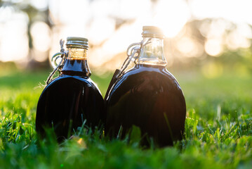 Bottles Of Maple Syrup In Natural Setting