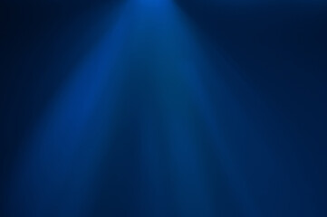 A beam of blue light cutting through the dark background