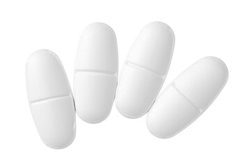 White oval pills isolated on white background, top view.