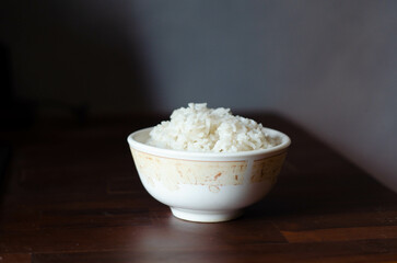 Cooked rice on wooden table - soft focus