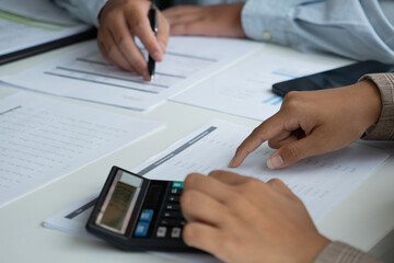 Fototapeta premium Businessman and businesswoman working together in an office