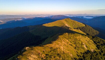 Fototapeta premium Breathtaking sunrise over rolling hills mountain range aerial photography natural landscape high angle scenic beauty