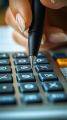 Hand using calculator