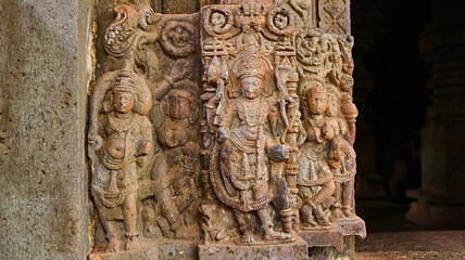 Carved sculptures of the doorkeepers at Shri Karneshwar Temple, Sangameshwar, Ratnagiri, Maharashtra, India.