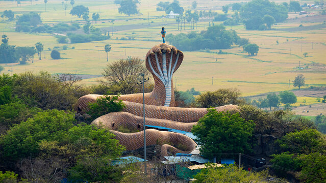 View of the Snake Temple depicting Lord Krishna standing on Kaliya (Kaliya Mardan), Nampalli, Telangana, India.