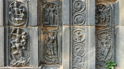 Carvings of Lord Shiva with Parvati and others on Shri Pachchala Someshwara Temple, Panagallu, Nalgonda, Telangana, India.