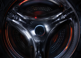 Inside the drum of a washing machine.