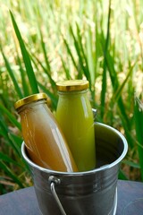 Fresh and healthy pressed juice in bottles. Made from blended vegetables and fruits. Healthy life...