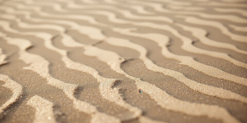 Fototapeta premium Monochromatic Beach Textures Close-up of pristine shoreline sand with gentle water ripples creating abstract linear patterns in subtle beige palette
