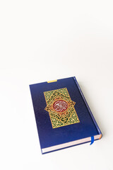 Holy Quran with Arabic calligraphy on white background