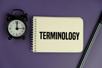 TERMINOLOGY words on the white notebook for research and philosophy concept, dark background