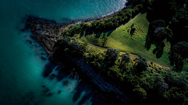 Ethereal view of duder regional park in auckland, showcasing nature and the turquoise water surrounding it