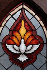 Stained glass artwork featuring dove and flames symbolizes divin
