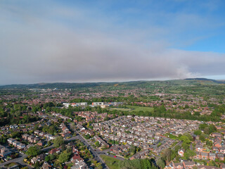 A plume of smoke over Macclesfield from a moorland wild fire on the moors of the Peak District