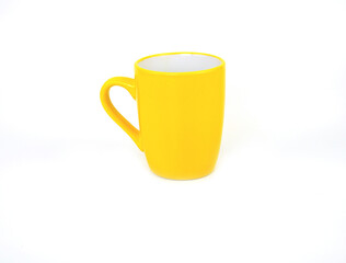 Side view, empty yellow mug isolated on white background. Blank yellow ceramic cup mockup and template for design, and banner. Use for home or restaurant.