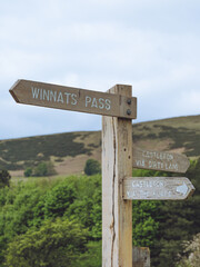 Fingerpost sign for Winnats Pass and Castleton in the Peak District, UK
