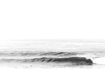 Large black and white wave breaks with one surfer in the water
