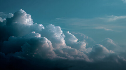 Fluffy white clouds drifting across a soft blue sky, with a patrician fog