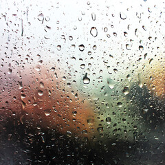 Rainy day window droplets abstract background texture weather glass condensation wet surface close up view 100