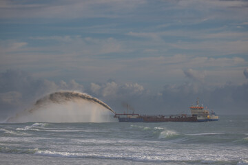 Sand blasts from ship in Tropical Cyclone Alfred recovery Queensland