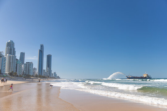 Gold Coast Skyline and Beach Near Sand Pumping Ship after cyclone