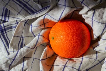 Fresh orange soft kitchen towel natural light Cozy slow living healthy eating sustainable lifestyle...