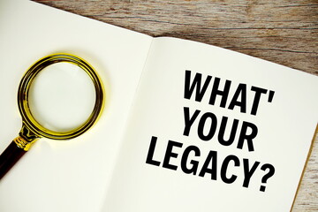 What's Your Legacy? text written on chalkboard with alarm clock on wooden background