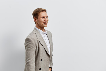 Smiling man working on laptop with casual jacket white background digital nomad concept remote work...