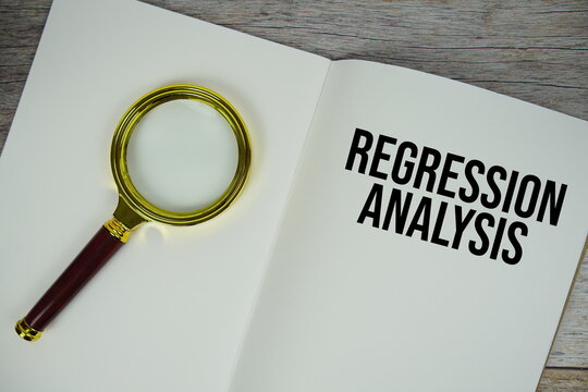 Regression Analysis text written on chalkboard with alarm clock on wooden background