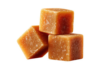 Stack of caramel candy cubes isolated on white background