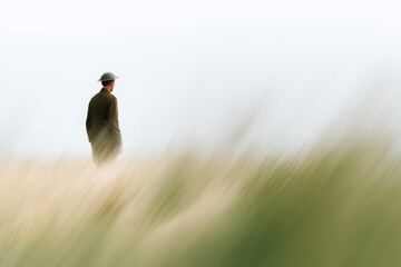 solitary soldier stands proudly in vast meadow symbolizing hope and victory on veday