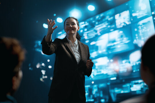 A woman is speaking on stage