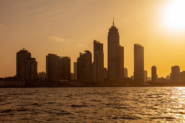 Picturesque evening view of Yantai city from a ship, China