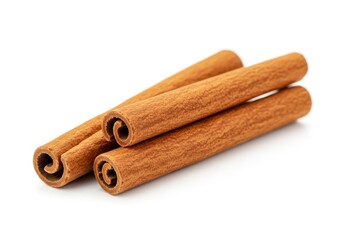 Three cinnamon sticks arranged in a pile, showcasing their rolled texture and warm brown color against a white background