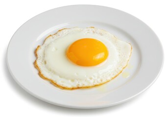 A sunny side up egg with a bright orange yolk sits on a white plate against a white background