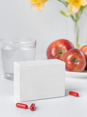 Blank White Product Package Box Mock-up. Open blank medicine drug box with Vatamin a blister top view. Place for logo and text